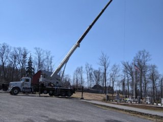 A crane is on site at the memorial