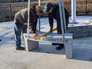 Workers use a level tool