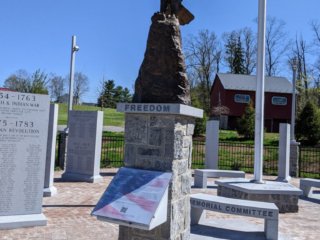 A bald eagle statue and the welcome plaque