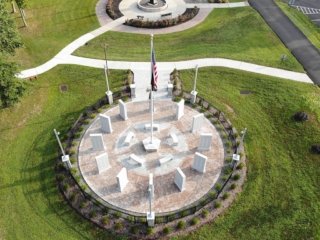 Close-up drone photo of memorial in March 2023.