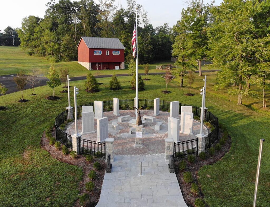 Side view drone photo of memorial in March 2023.